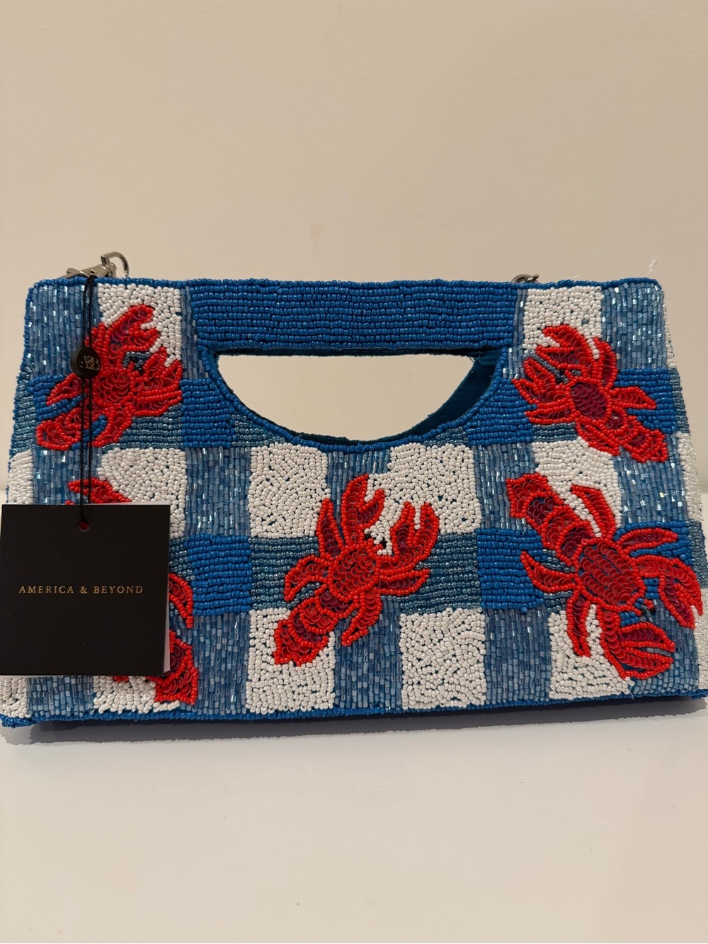 America & Beyond Blue Beaded Checker Clutch with Red Crab Motif